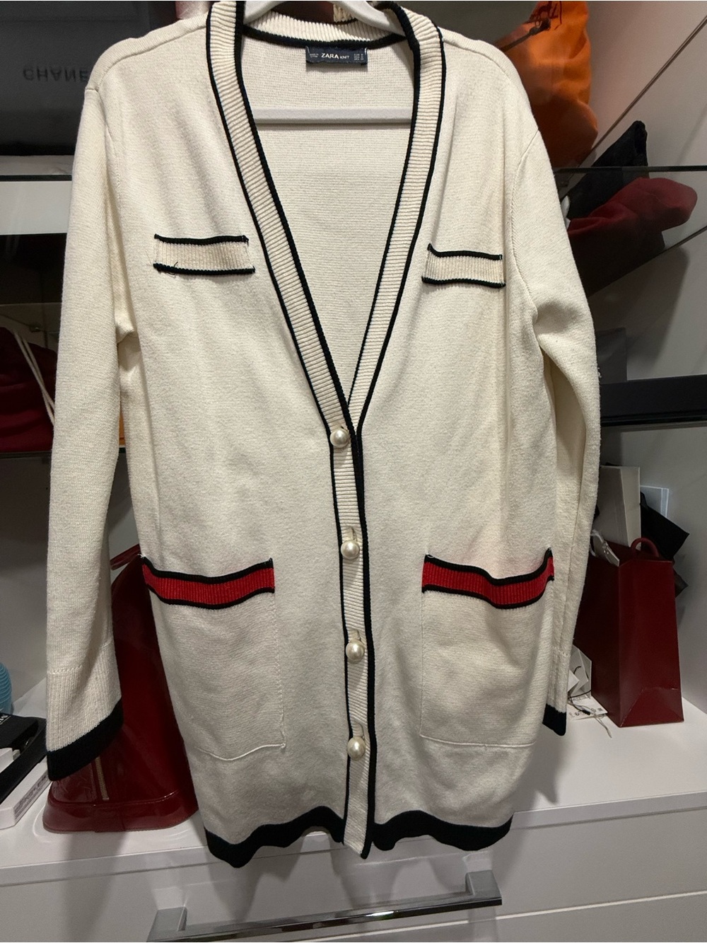 Zara Cream Long Cardigan with Black Trim and Red Pocket Accents